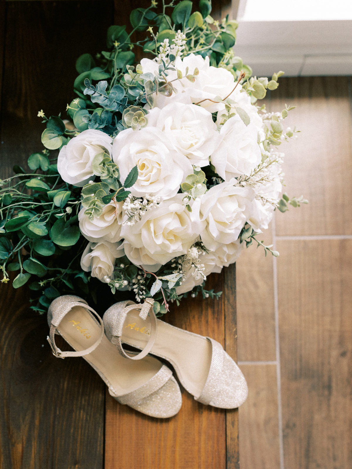 timeless gold wedding heels for bride and white roses bouquet