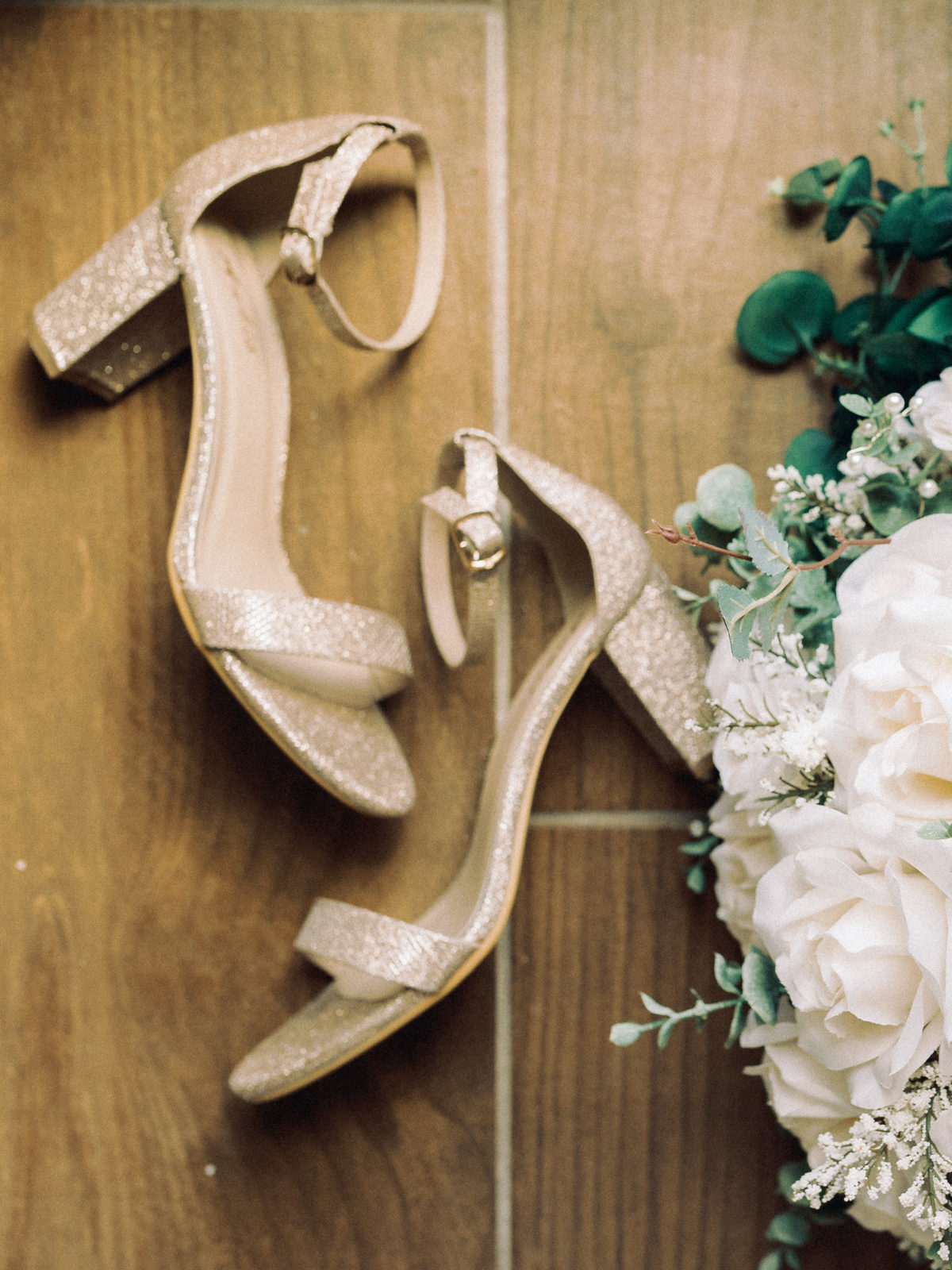 timeless gold wedding heels for bride and white roses bouquet