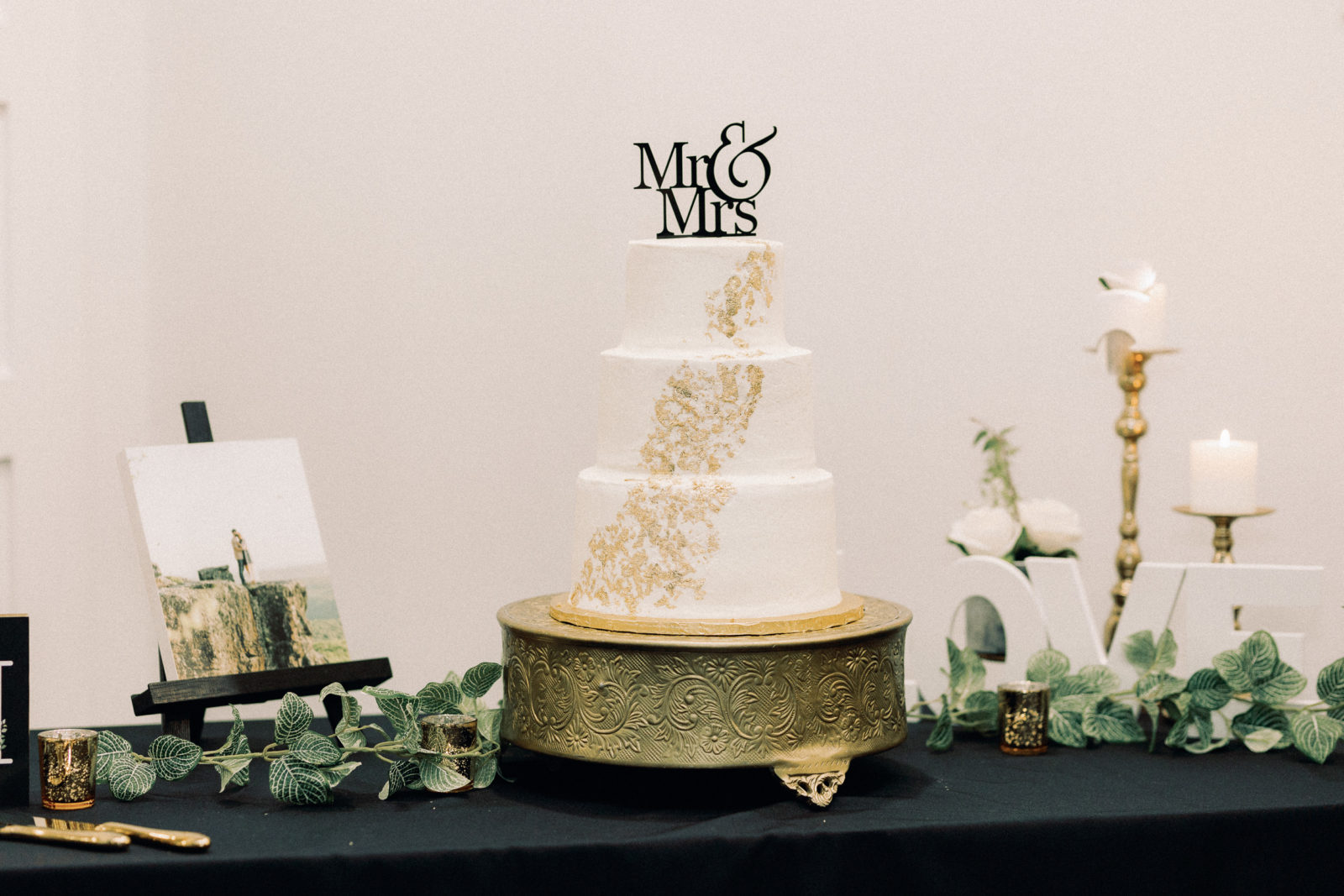 timeless black and gold three tiered wedding cake
